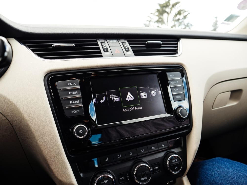 Car dash with head unit screen that's displaying android auto