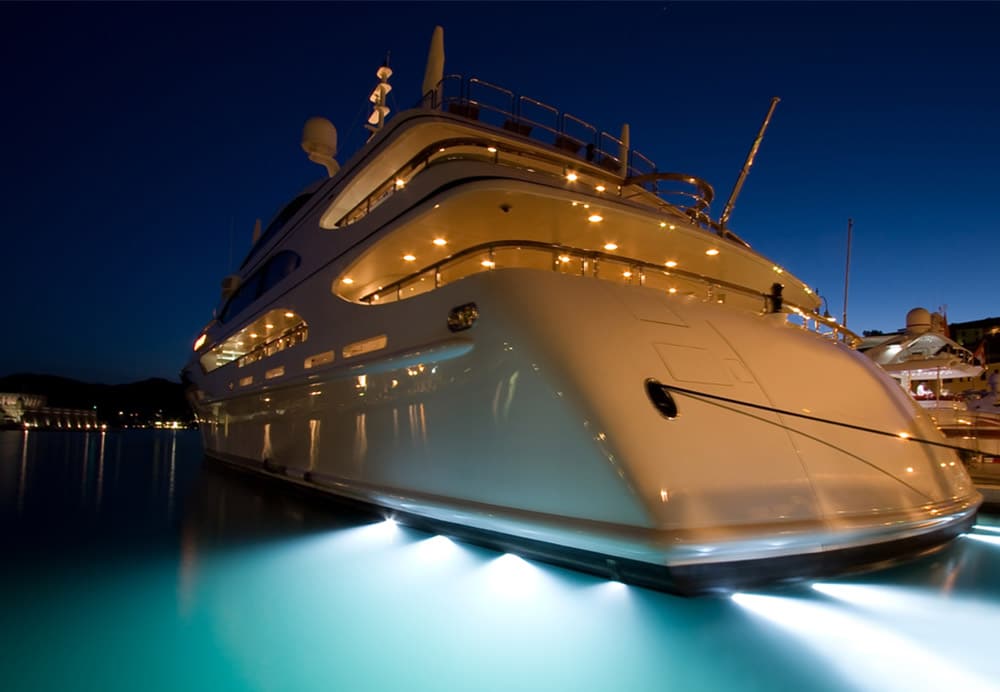 Yacht with best underwater led lights in harbor