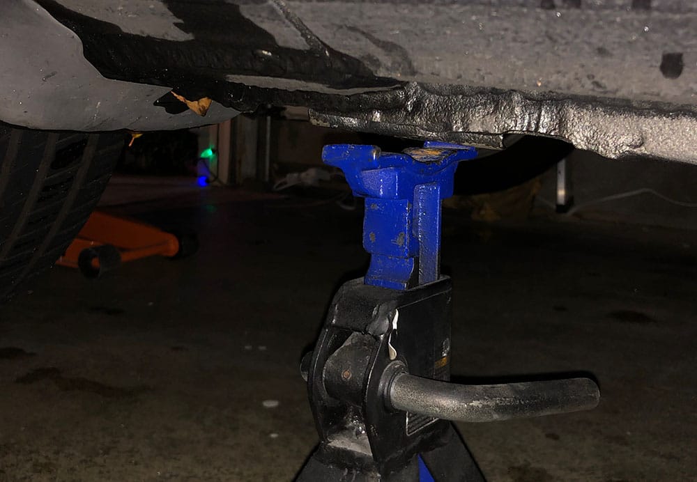 Jack stand underneath reinforced area of honda accord.