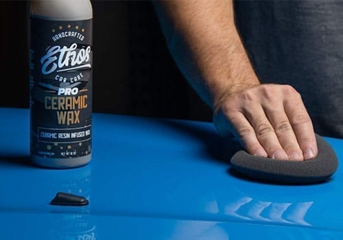 Ethos Ceramic Wax PRO application with bottle and applicator on car hood