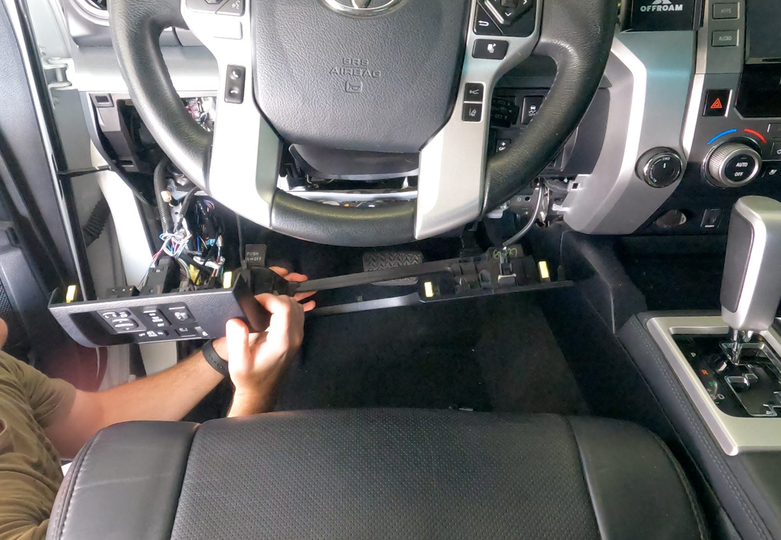 Removing panels below steering wheel