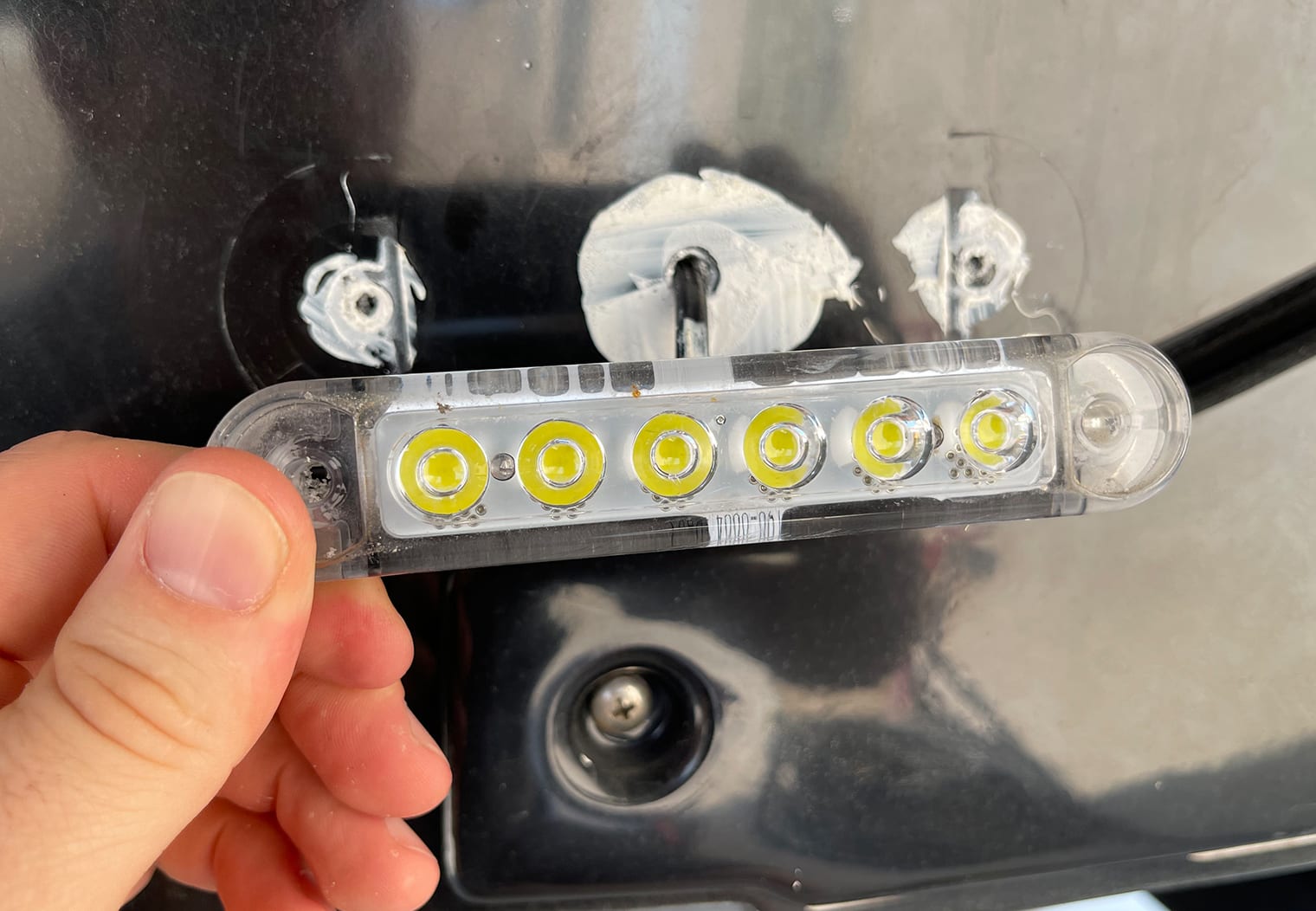 Removing the starboard OEM underwater LED on a Nautique G23