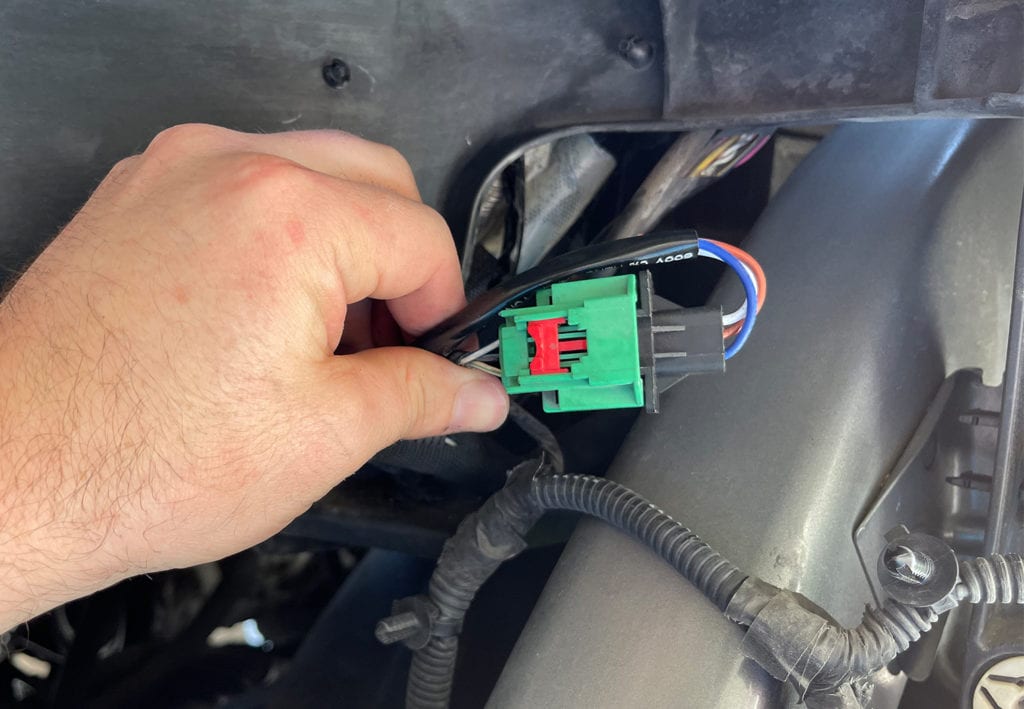 Plugging in HID headlight harness while installing on ram 1500