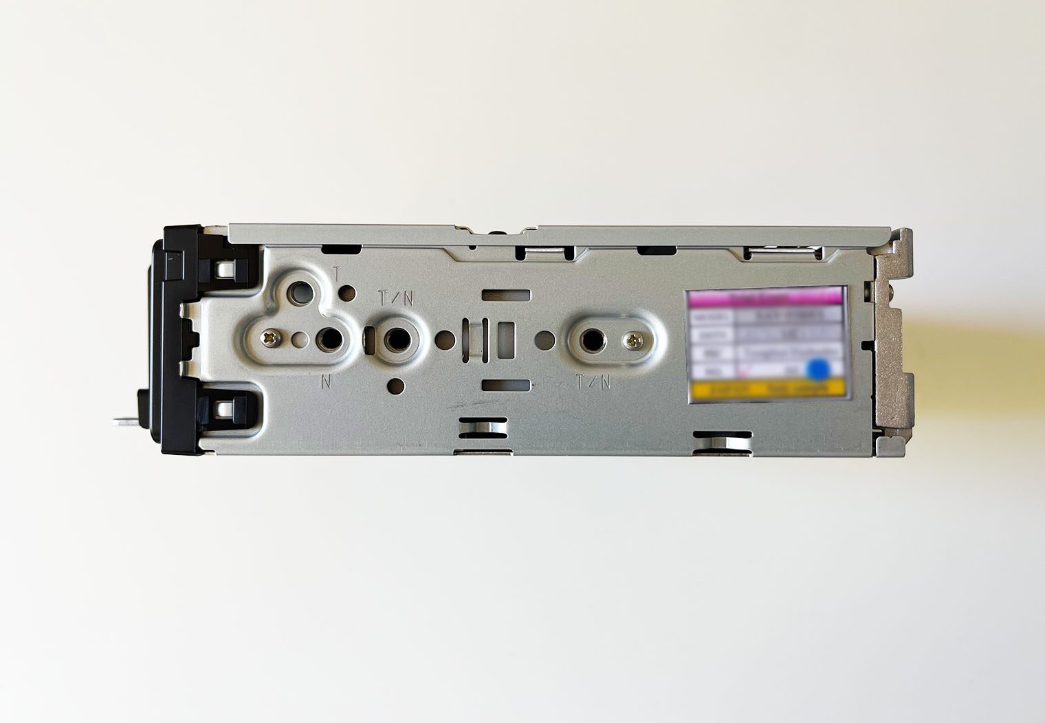 Side view of the Sony XAV-9500ES single din chassis with the screw holes