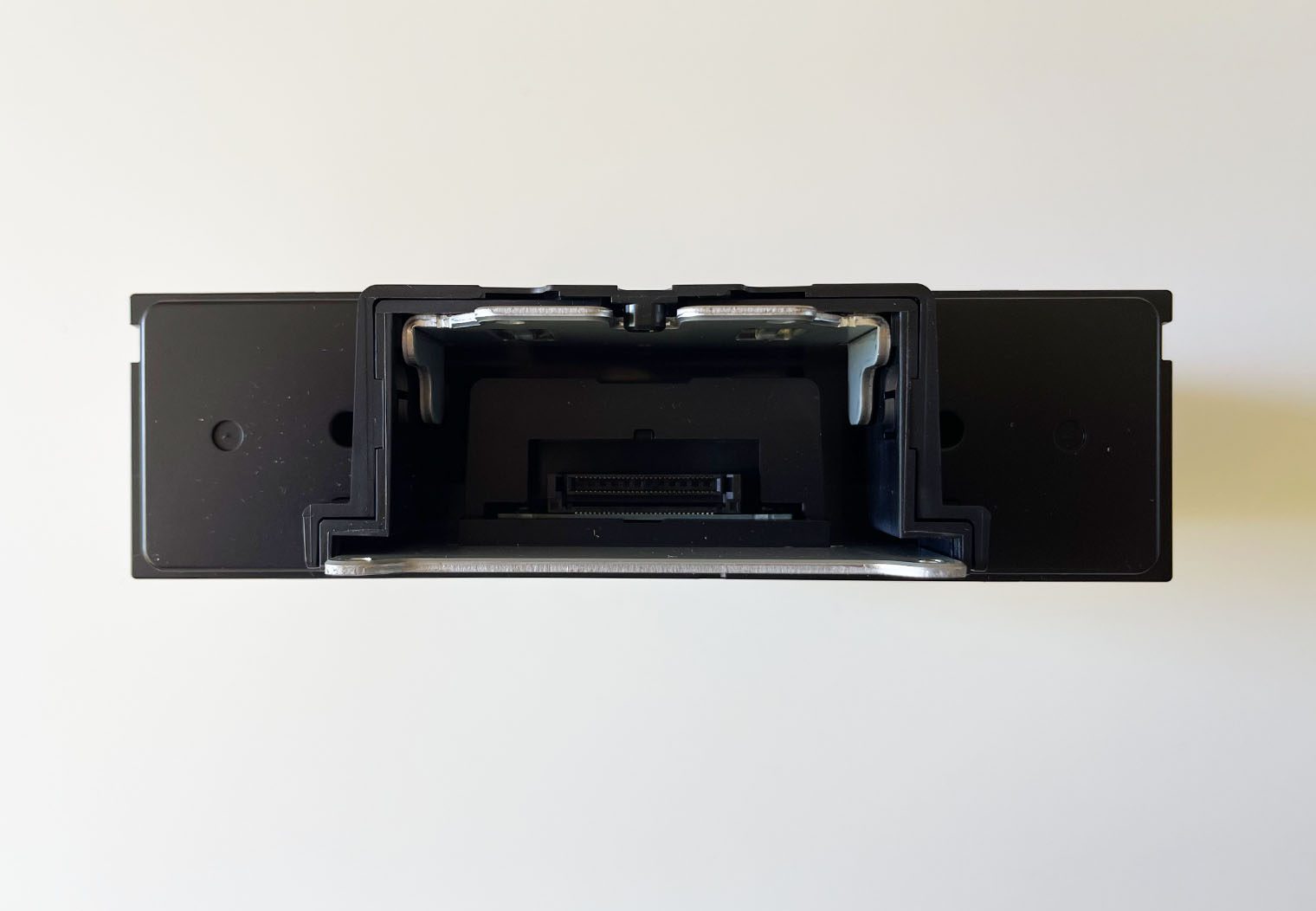 Front view of the Sony XAV-9500ES single din chassis where the screen meets the chassis