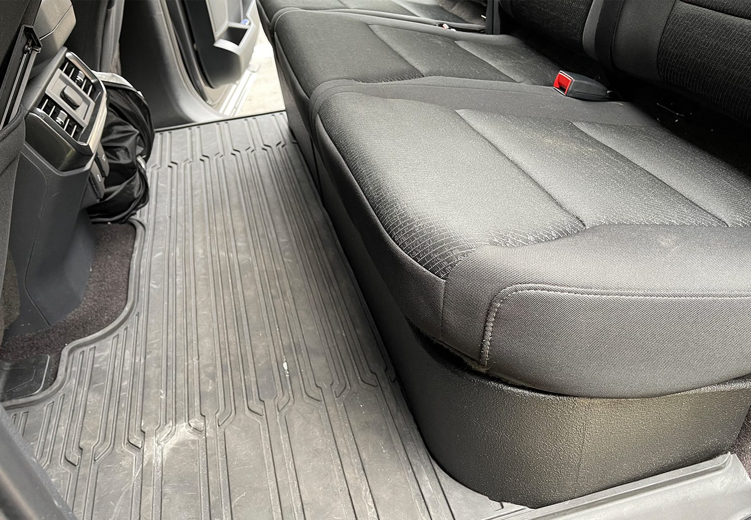 Rounded corner fitment on the driver side of the rear seats
