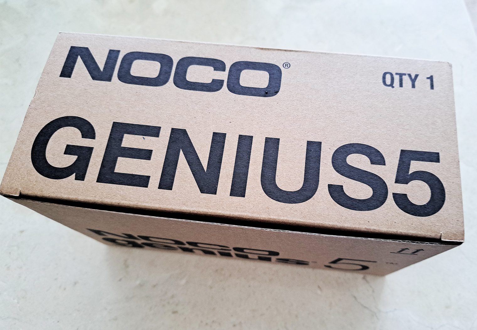 NOCO Genius5 in Shipping Box Angle