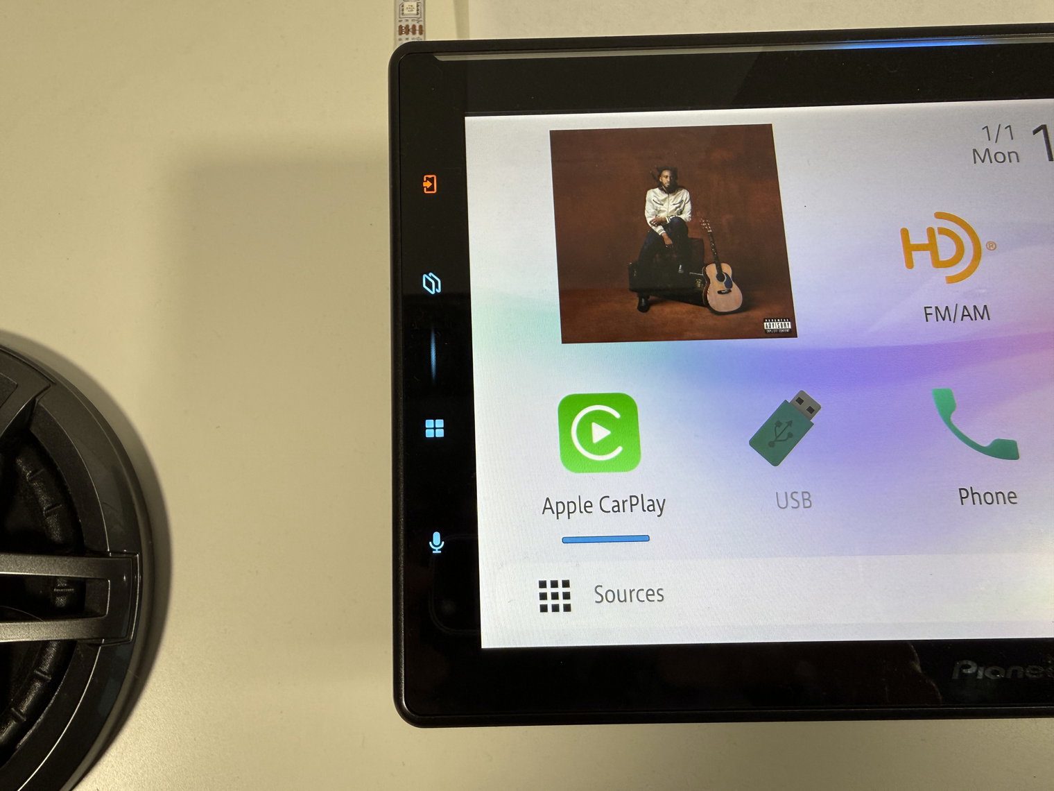 The four lit capacitive keys on the left edge of the Pioneer DMH-WT8000NEX monitor, next to the home screen