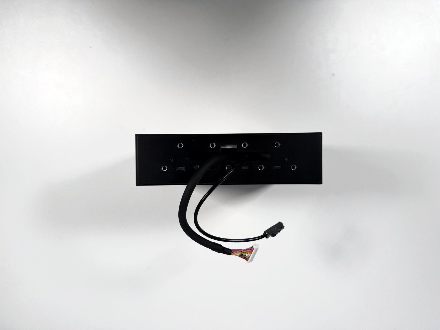 Front face of the Pioneer DMH-WT8000NEX single-DIN chassis with its screw holes and the two screen cables