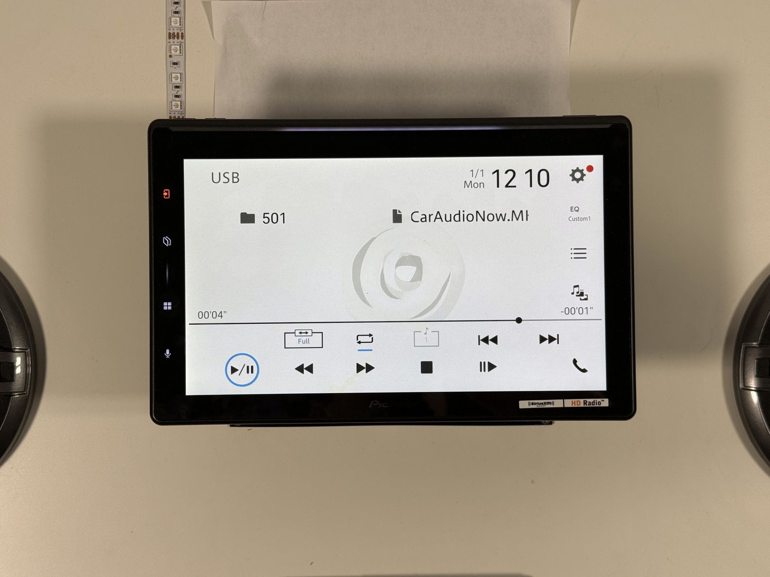 Pioneer DMH-WT8000NEX USB playback screen for a CarAudioNow video file, with time bar and playback controls