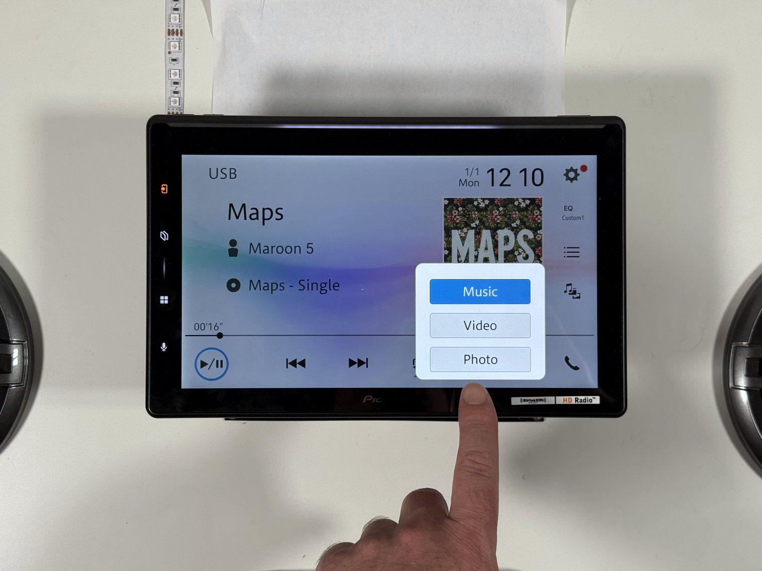 Pioneer DMH-WT8000NEX USB music screen playing Maroon 5 'Maps' with a Music, Video, Photo selector open