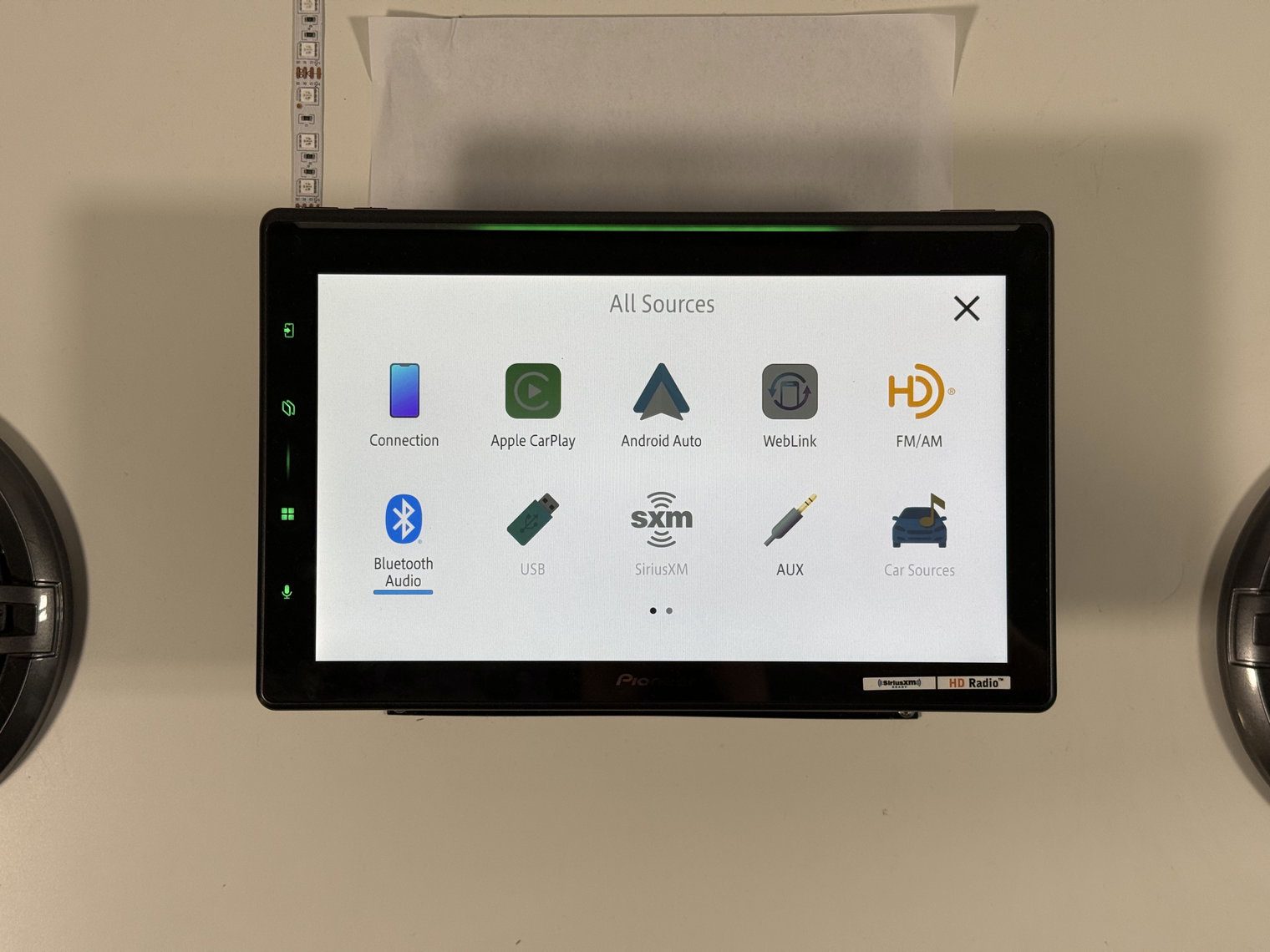 Pioneer DMH-WT8000NEX All Sources menu page one with CarPlay, Android Auto, FM/AM, Bluetooth Audio and more