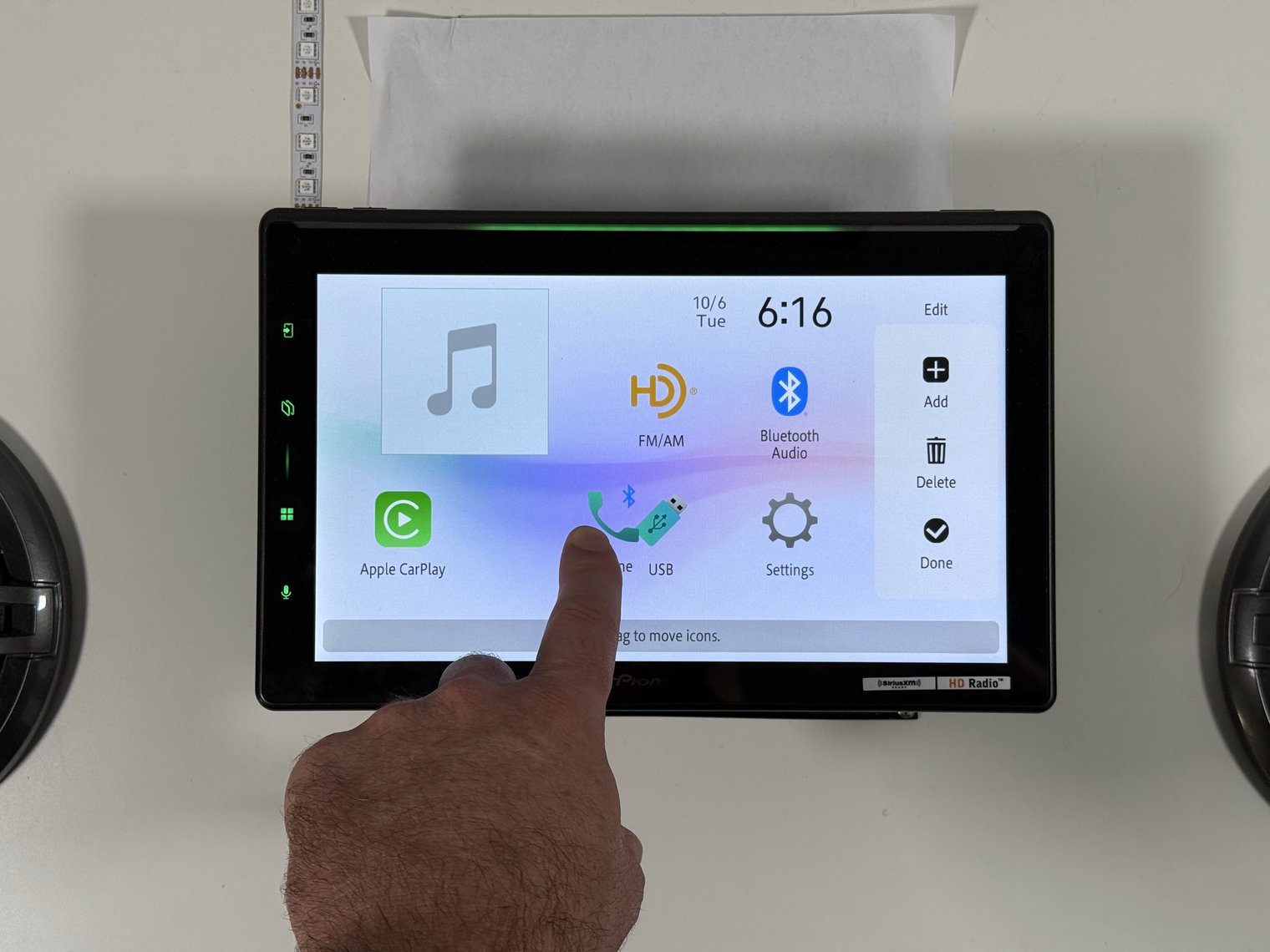 Moving a home screen icon in edit mode on the Pioneer DMH-WT8000NEX, with Add, Delete and Done on the right